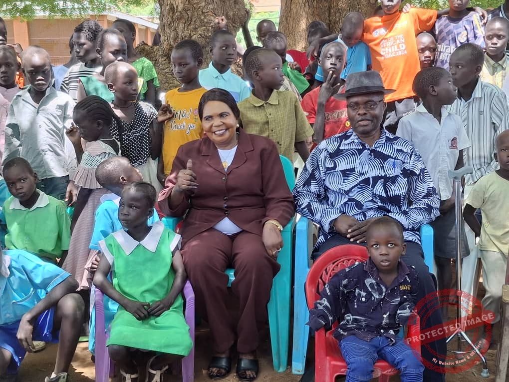 African Union's Representative (left) Jerome Biswaro with orphans at Juba Orphanage Center [File photo]