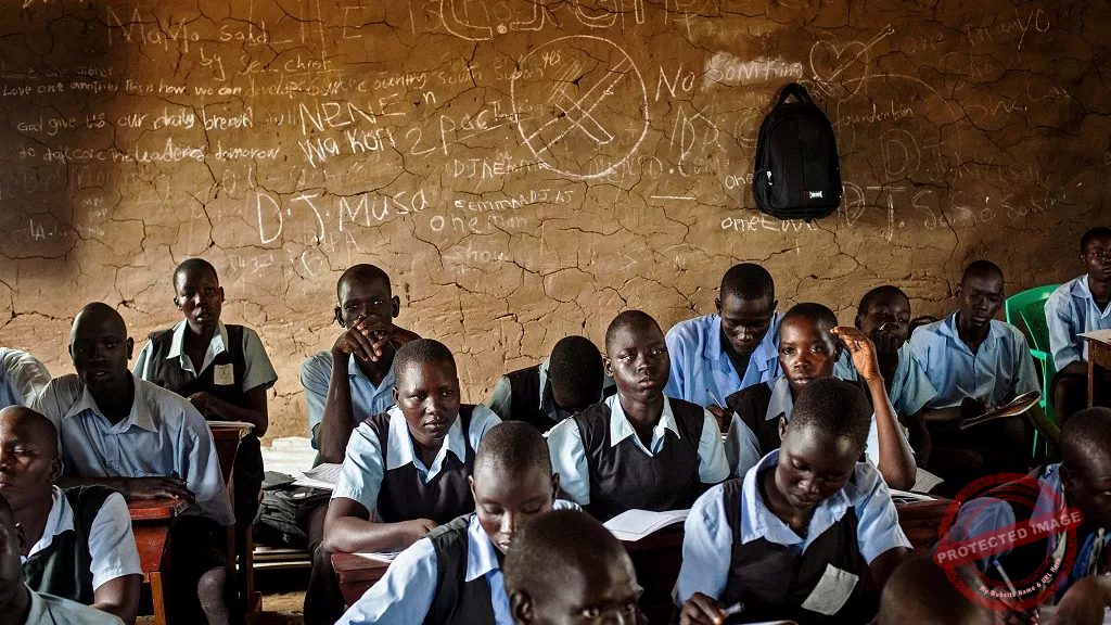 Students take notes during an English language class at the Juba Nabari Primary School, in Juba on April 9, 2014 - [Photo credit: Africa News]